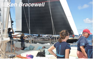 Photgraph of sailing crew watching yachts race